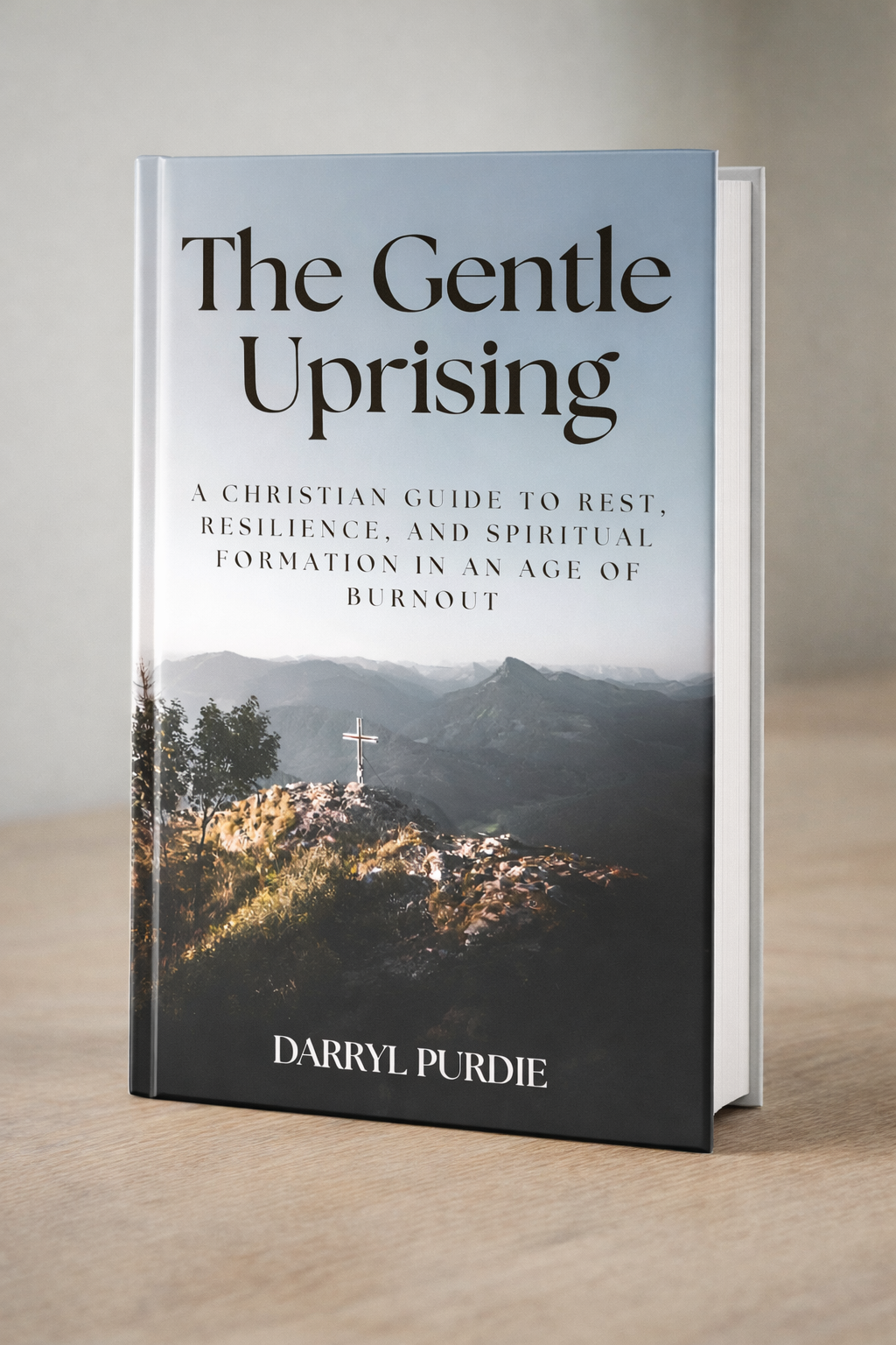 The Gentle Uprising book cover by Darryl Purdie — a cross on a mountain peak overlooking misty valleys